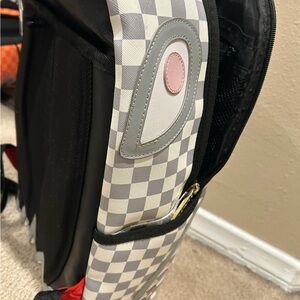 Sprayground Checkered Backpack with Pink Accent